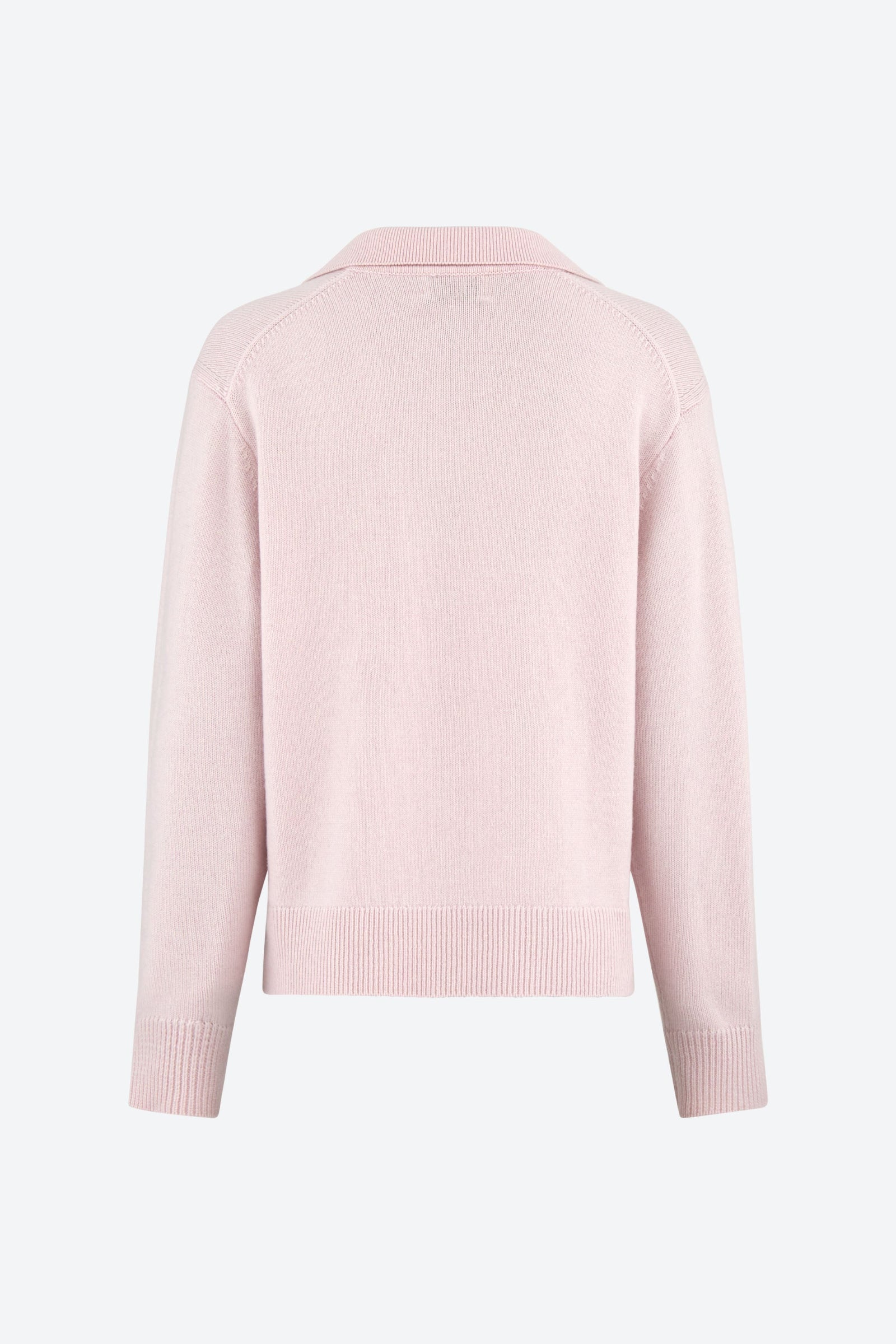 A back view of a light pink polo-style knit jumper with long sleeves and ribbed cuffs.
