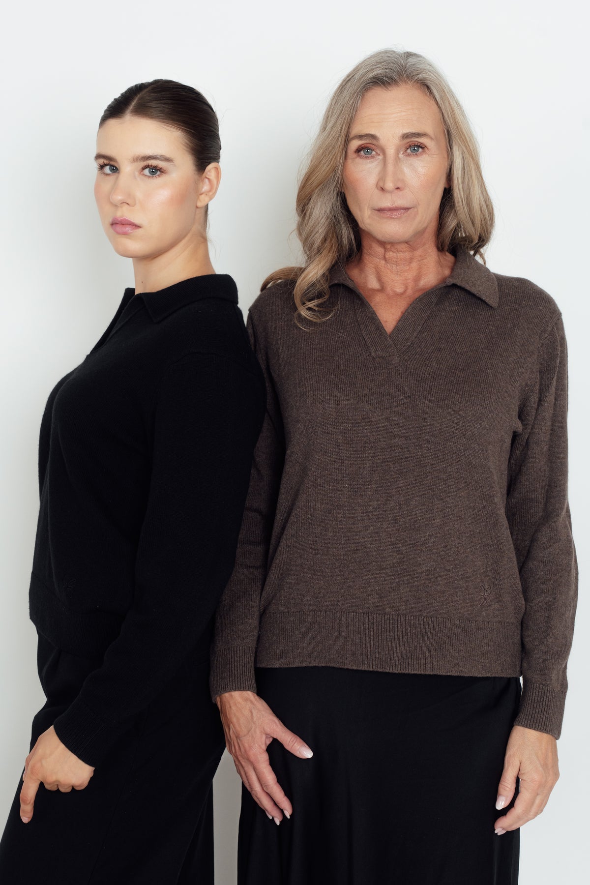 Dark brown Cashmere-Merino Polo Jumper on the right, shown beside a black polo jumper.