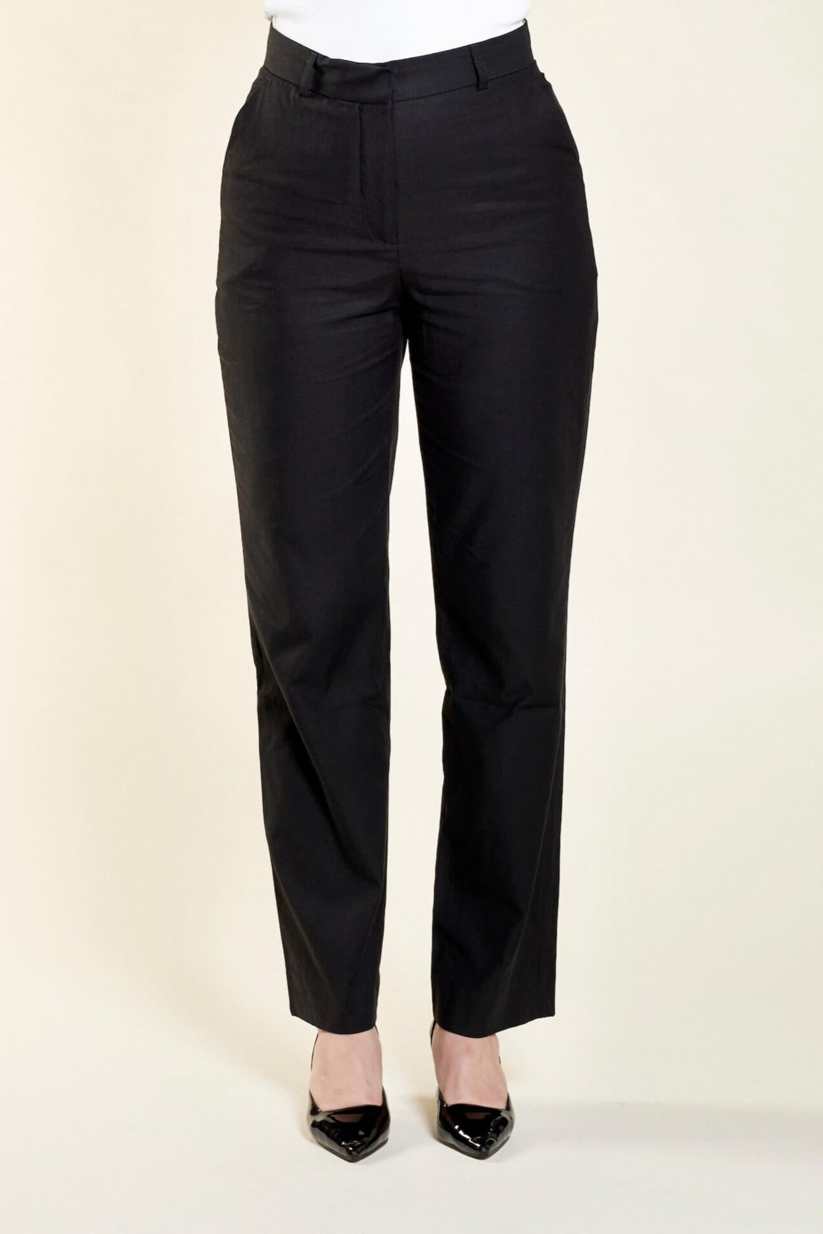 Elegant black trousers from Cyme Copenhagen, crafted from natural materials like lyocell, demonstrating the brand's commitment to timeless design and sustainable, inclusive fashion.