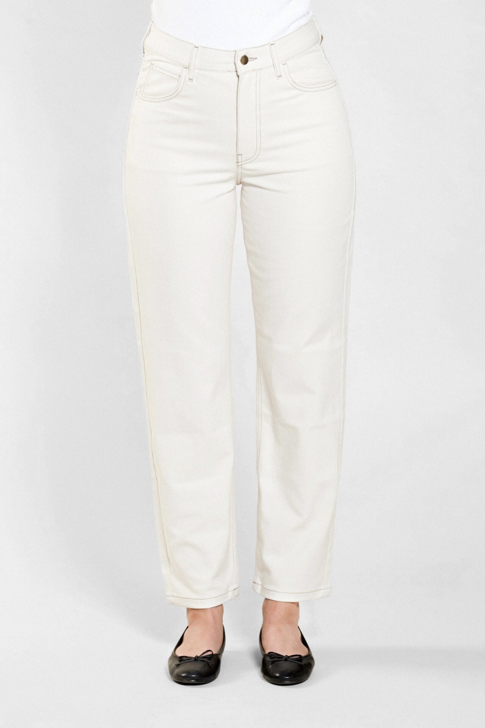 Front view of Cyme Copenhagen's classic cream denim trousers, showcasing the sophisticated cut and sustainable quality materials characteristic of the Danish designer fashion brand.