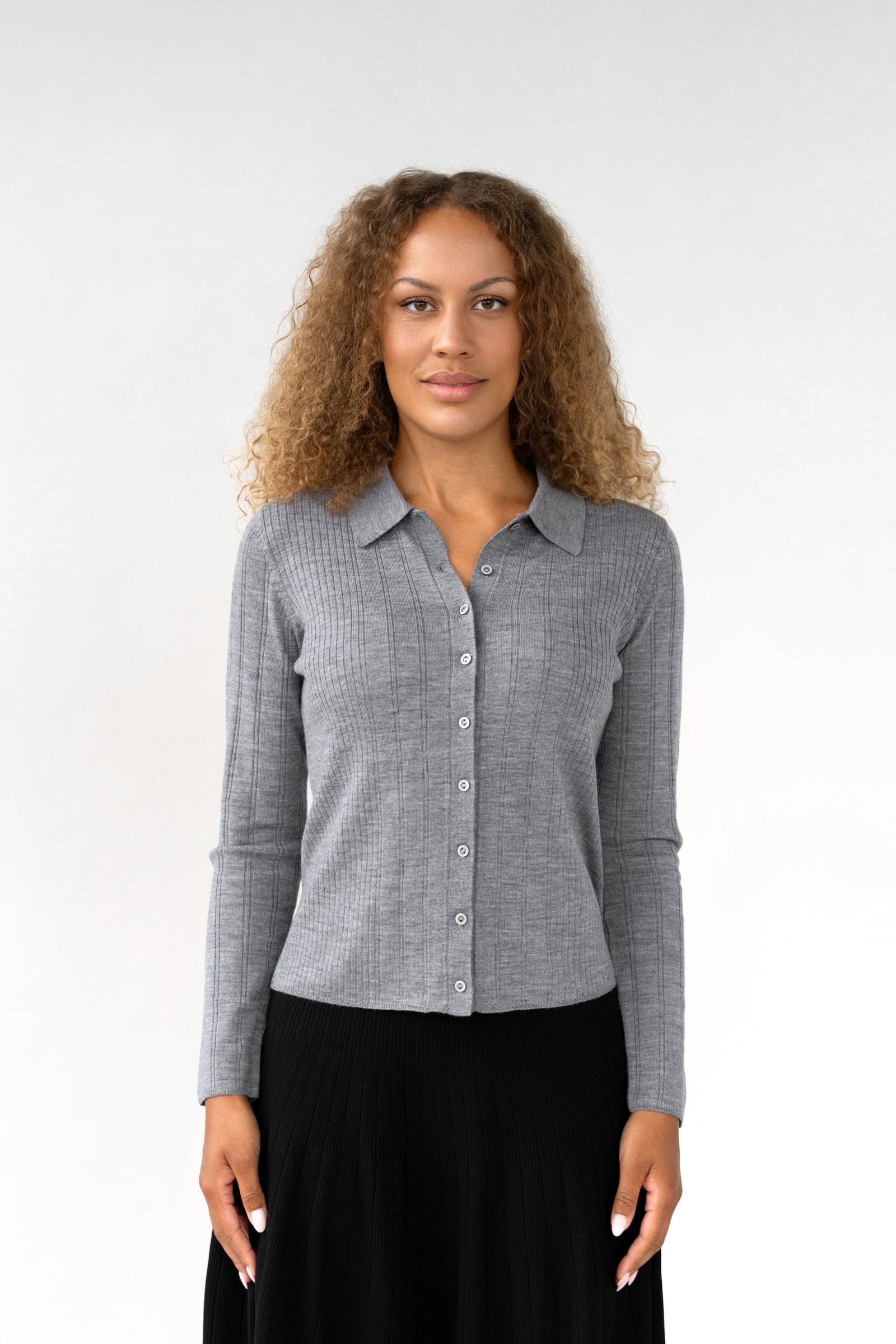 On-model front view of ribbed knit collared cardigan, light grey, buttoned, studio.