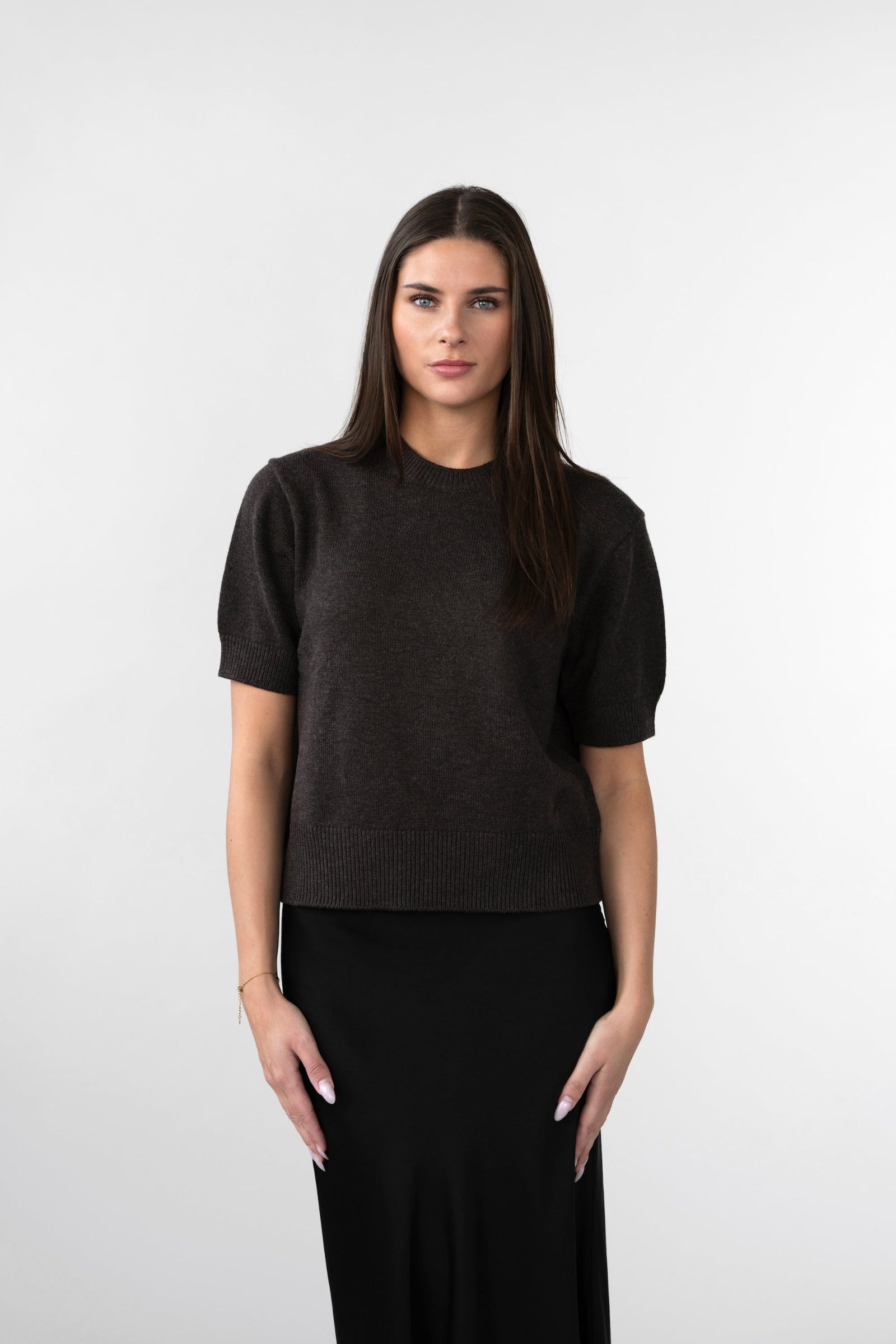 On-model front view of women's short-sleeve knit top, crew neck, dark brown, CYME Copenhagen studio.