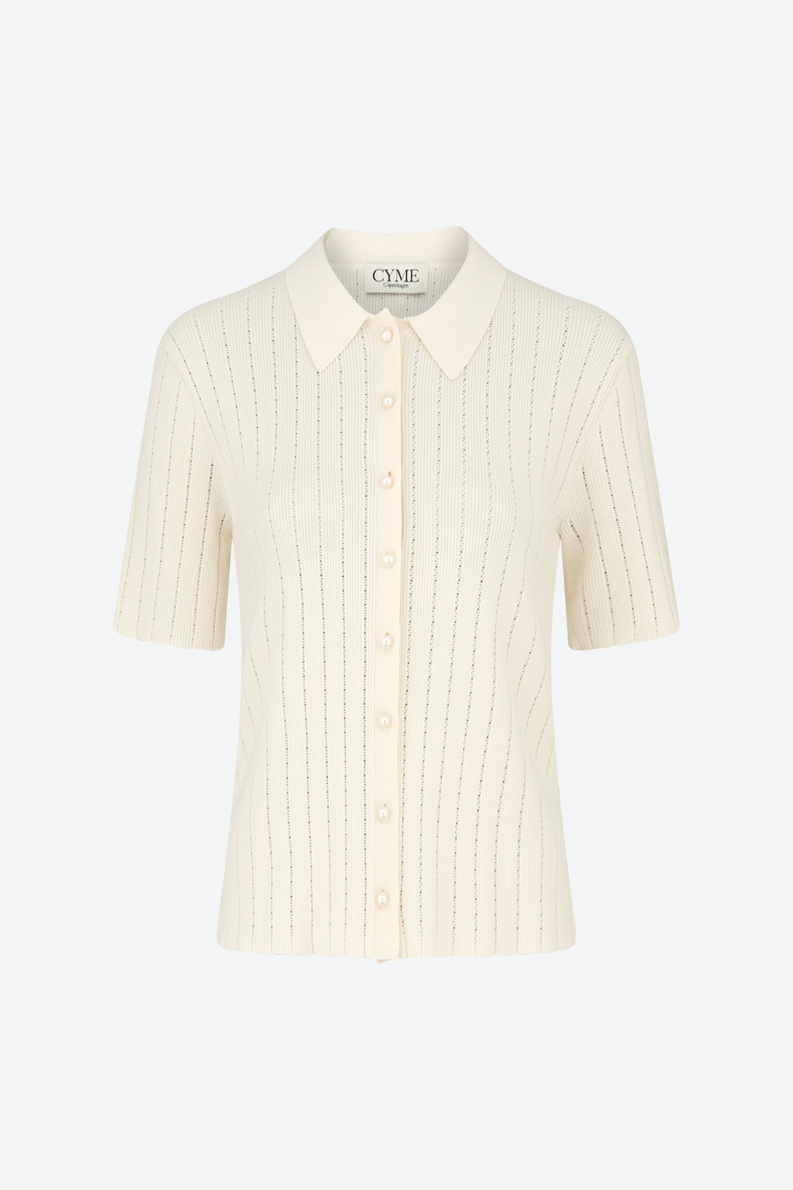 Front view of the CYME Polo Shirt in ivory with signature pearl buttons. This timeless style is made in a soft, breathable fabric for everyday sophistication.
