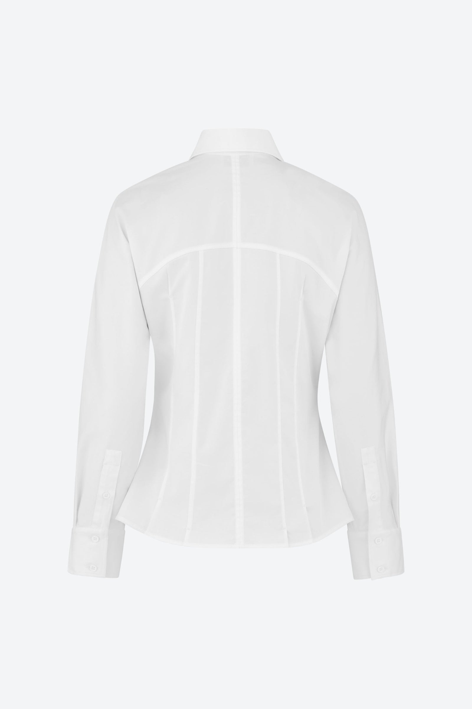 Back view of a white, long-sleeve, tailored shirt with a pointed collar. The shirt features vertical seams that enhance the fit and has a structured design, displayed on a plain background.