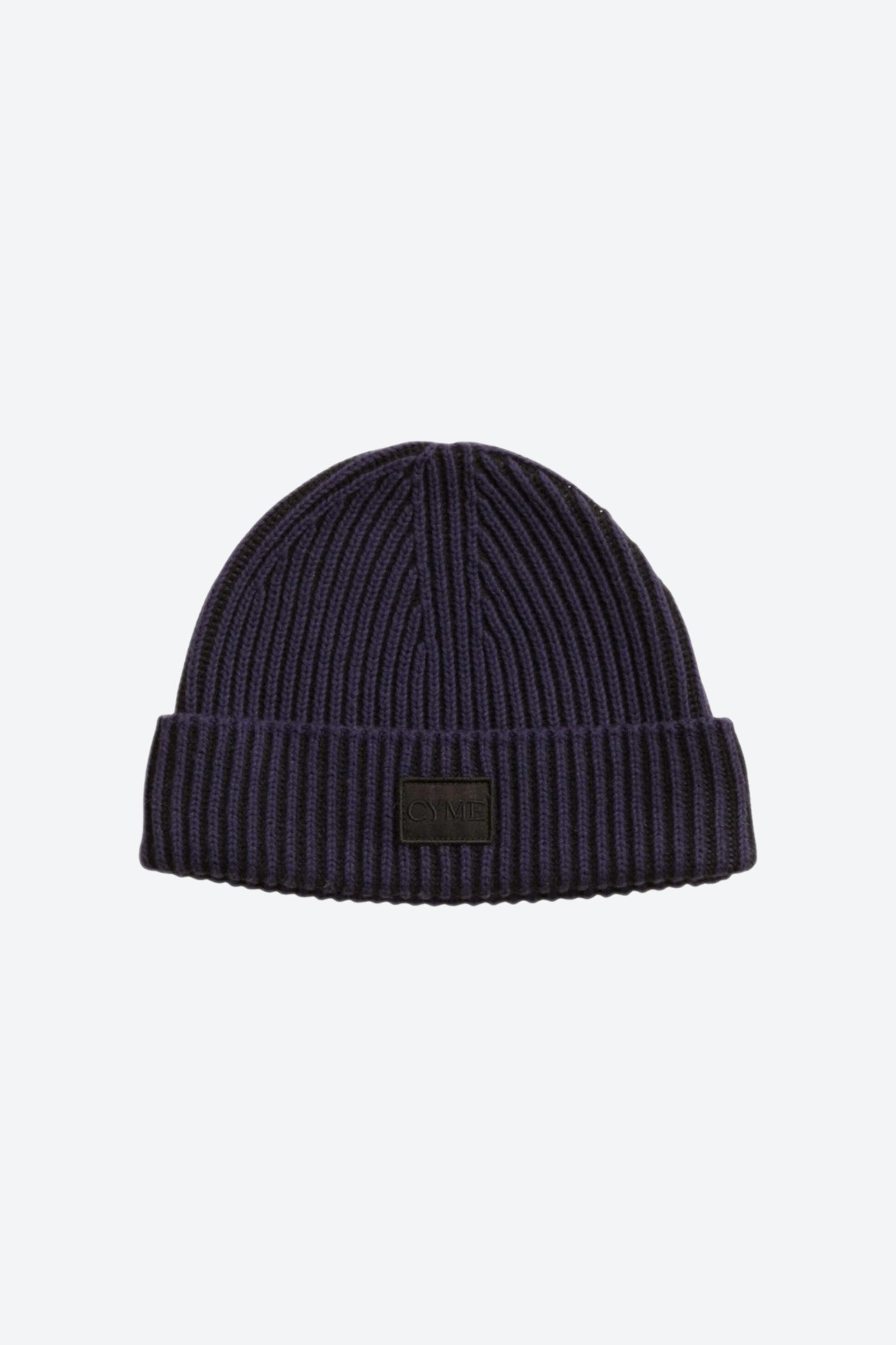 Classic navy cashmere beanie by Cyme Copenhagen, showcasing the brand's signature logo, perfect for a timeless look in the sustainable fashion collection of Scandinavia.