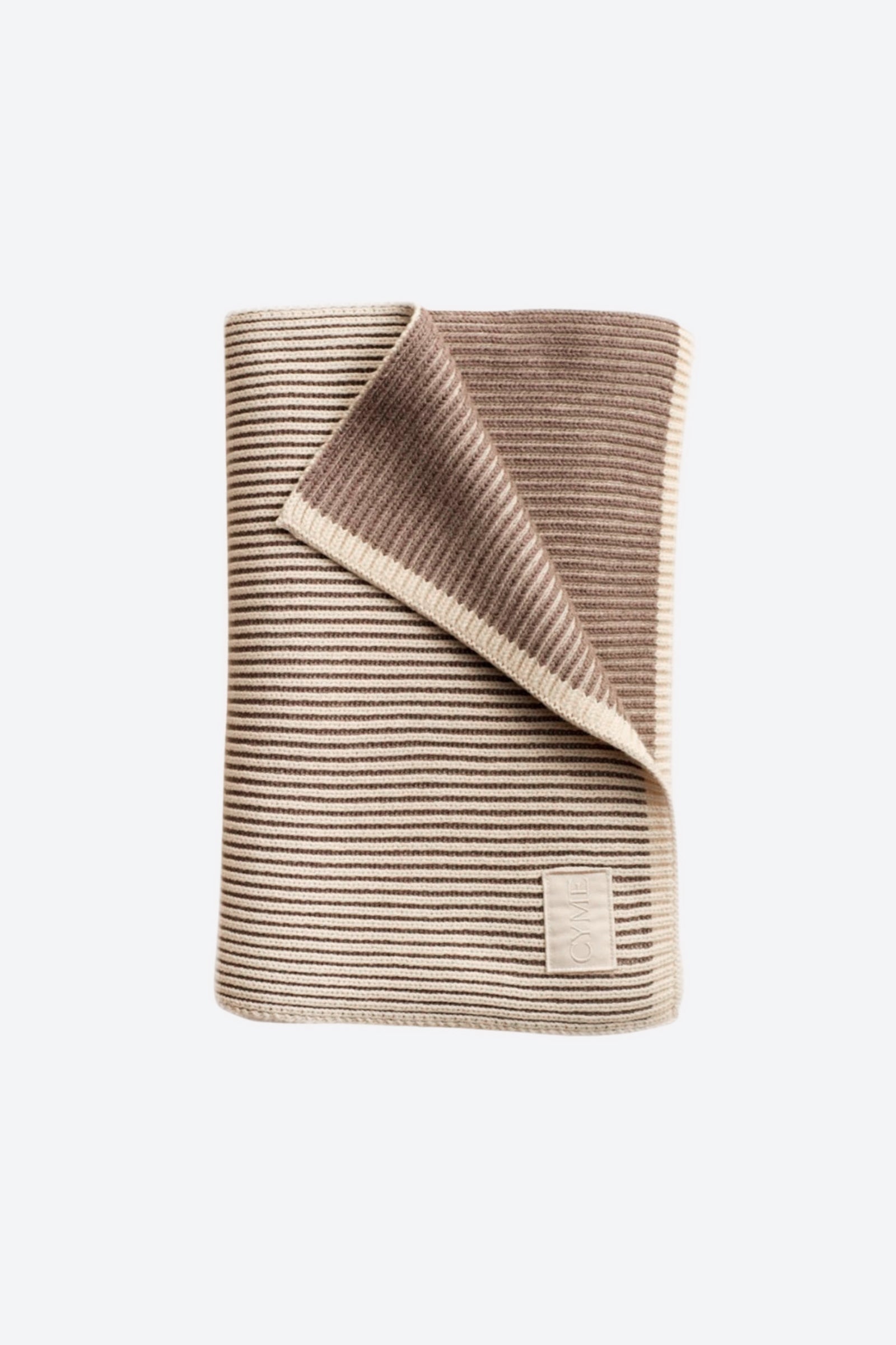 Premium cashmere scarf featuring neutral stripes, elegantly unfolded to showcase the Cyme Copenhagen logo, reflecting the brand’s commitment to natural materials and Scandinavian timeless design.