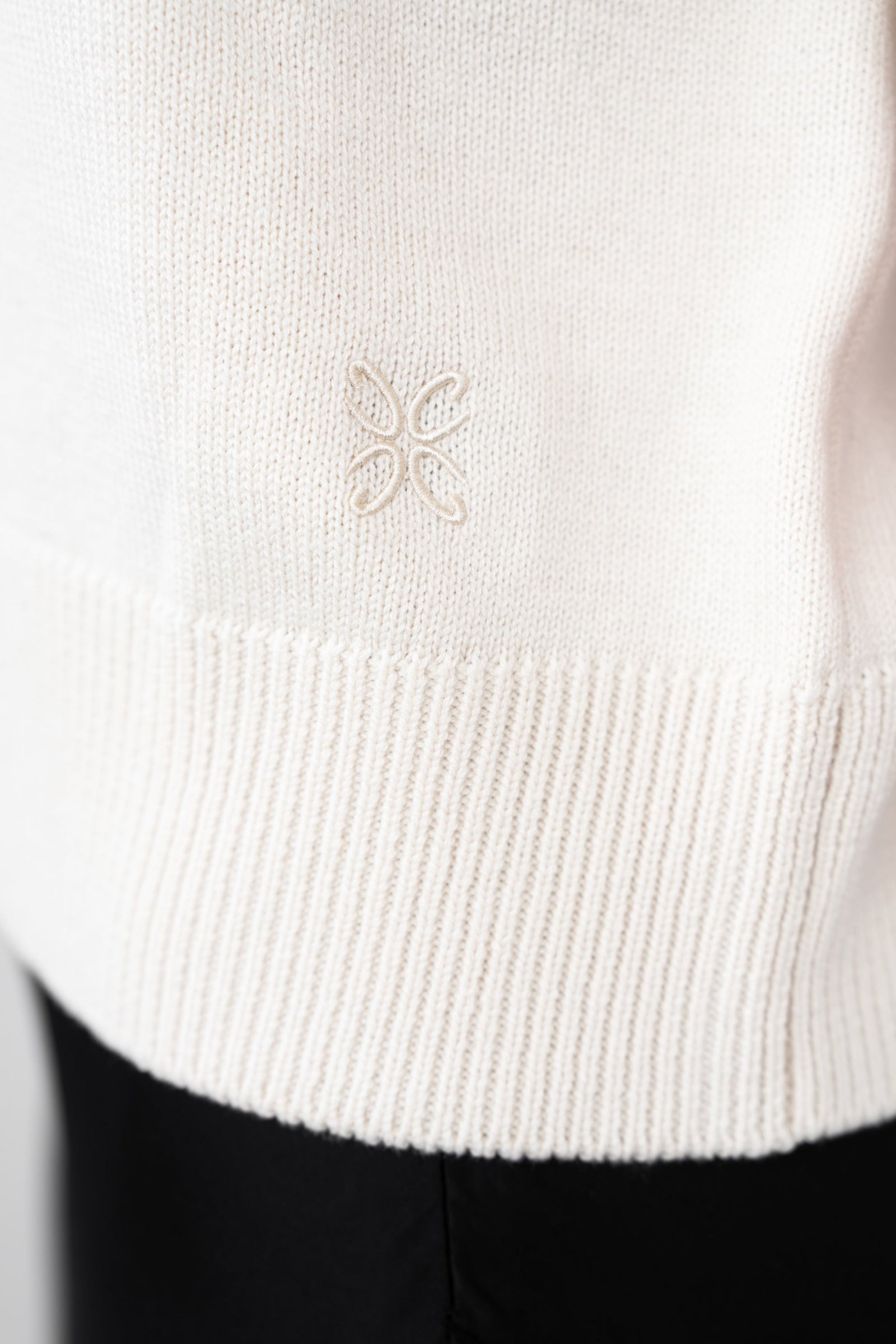 A close up of the CYME monogram