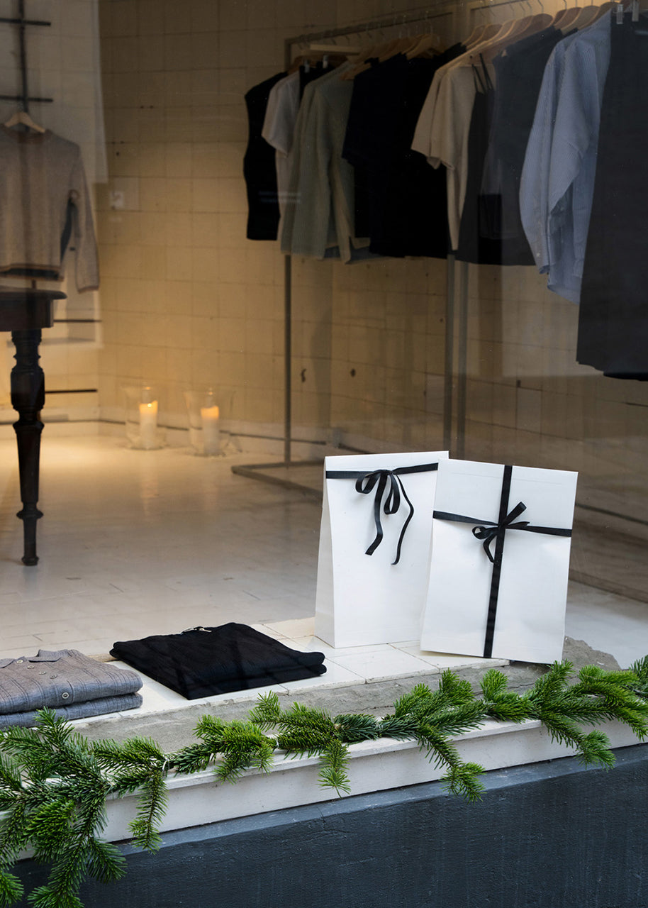 CYME Copenhagen clothing racks displayed at the Christmas pop-up store in Copenhagen, December 2025
