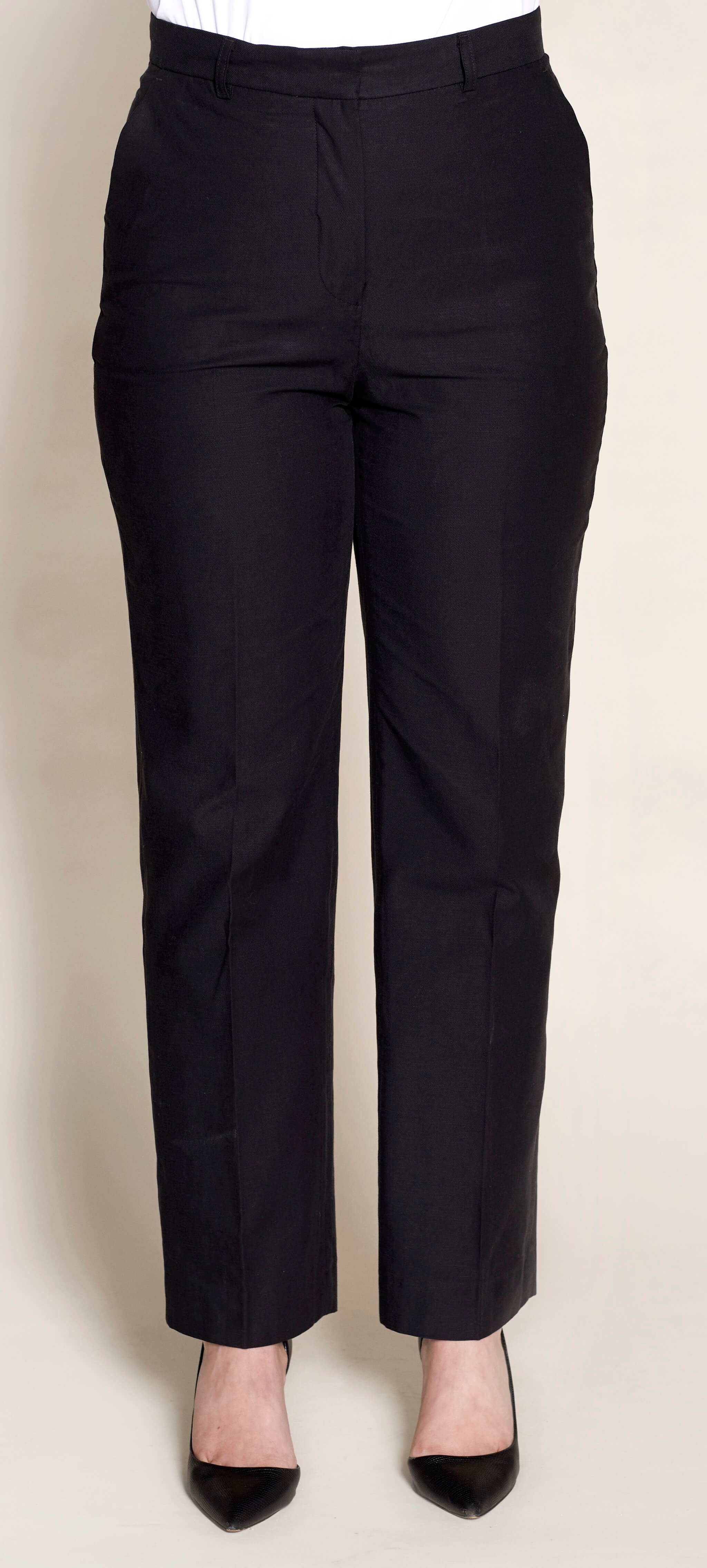 Elegant black trousers from Cyme Copenhagen also available in plus-size, crafted from natural materials like lyocell, demonstrating the brand's commitment to timeless design and sustainable, inclusive fashion.
