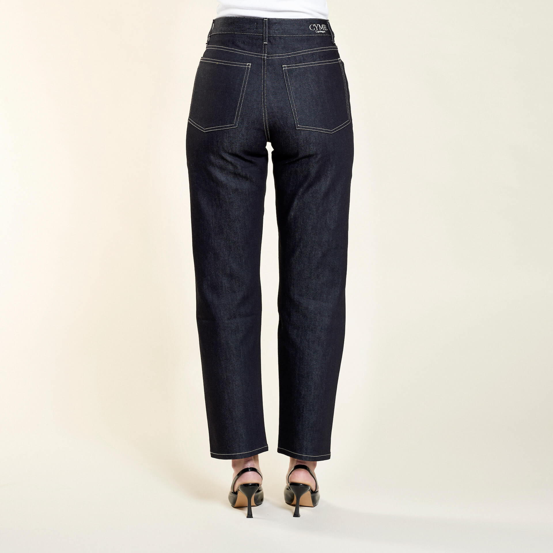 Full-length back view of Cyme Copenhagen's dark denim jeans, accentuating the natural fabric and timeless design, tailored for the fashion-conscious individual.