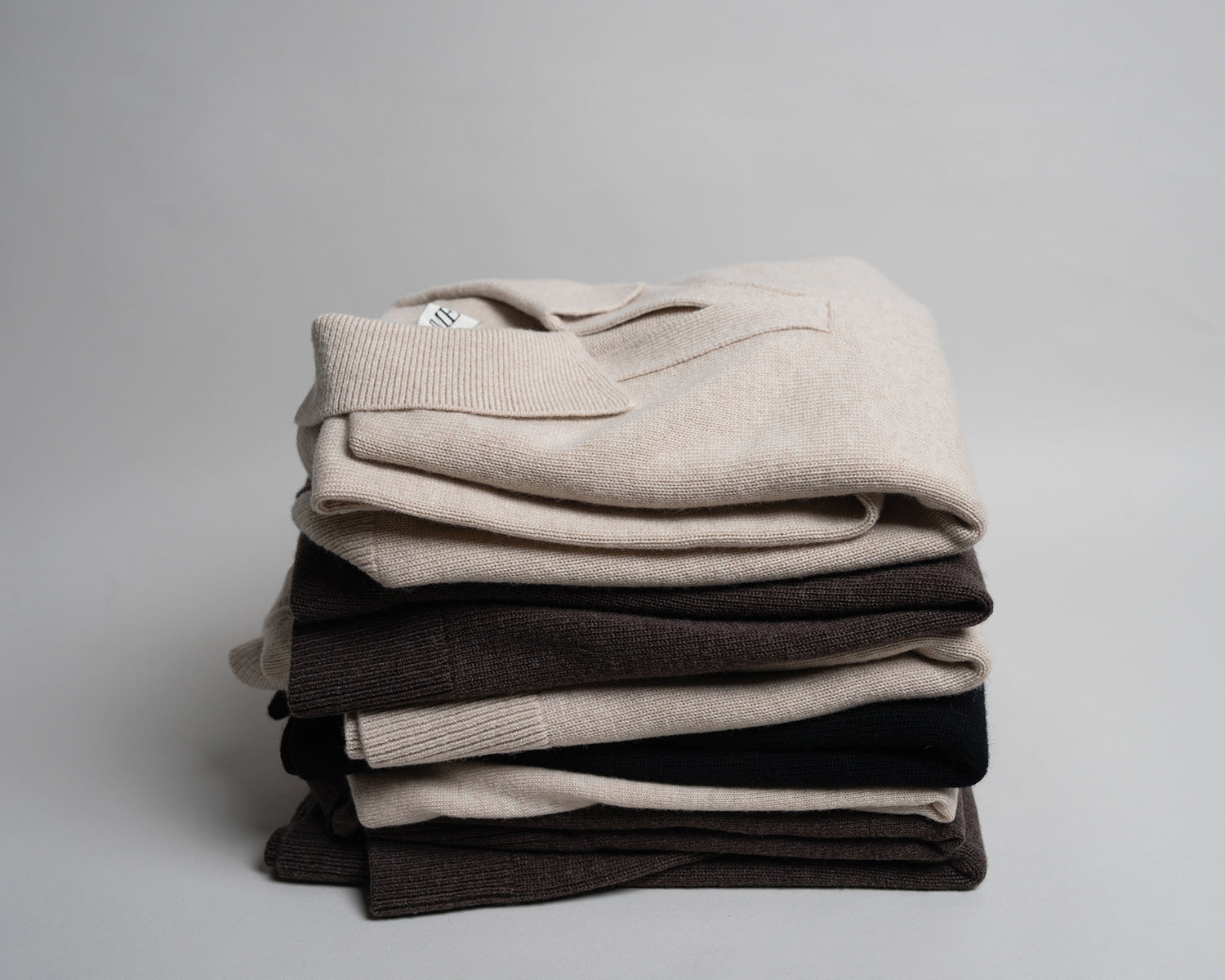Soft knitwear, neatly folded.
