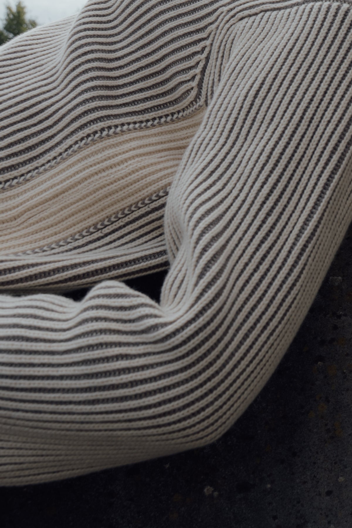 Close-up of the Cream/Fur Cotton Cashmere Jumper's narrow stripes and ribbed sleeve.