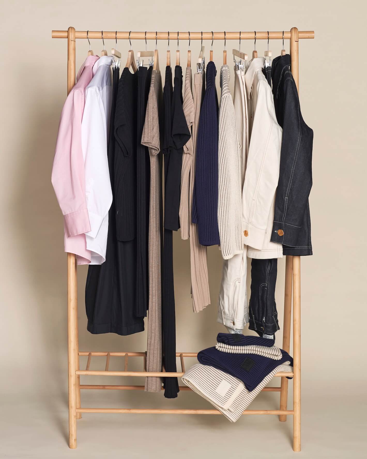 Cyme Copenhagen clothing on a rack, showcasing the timeless collections.