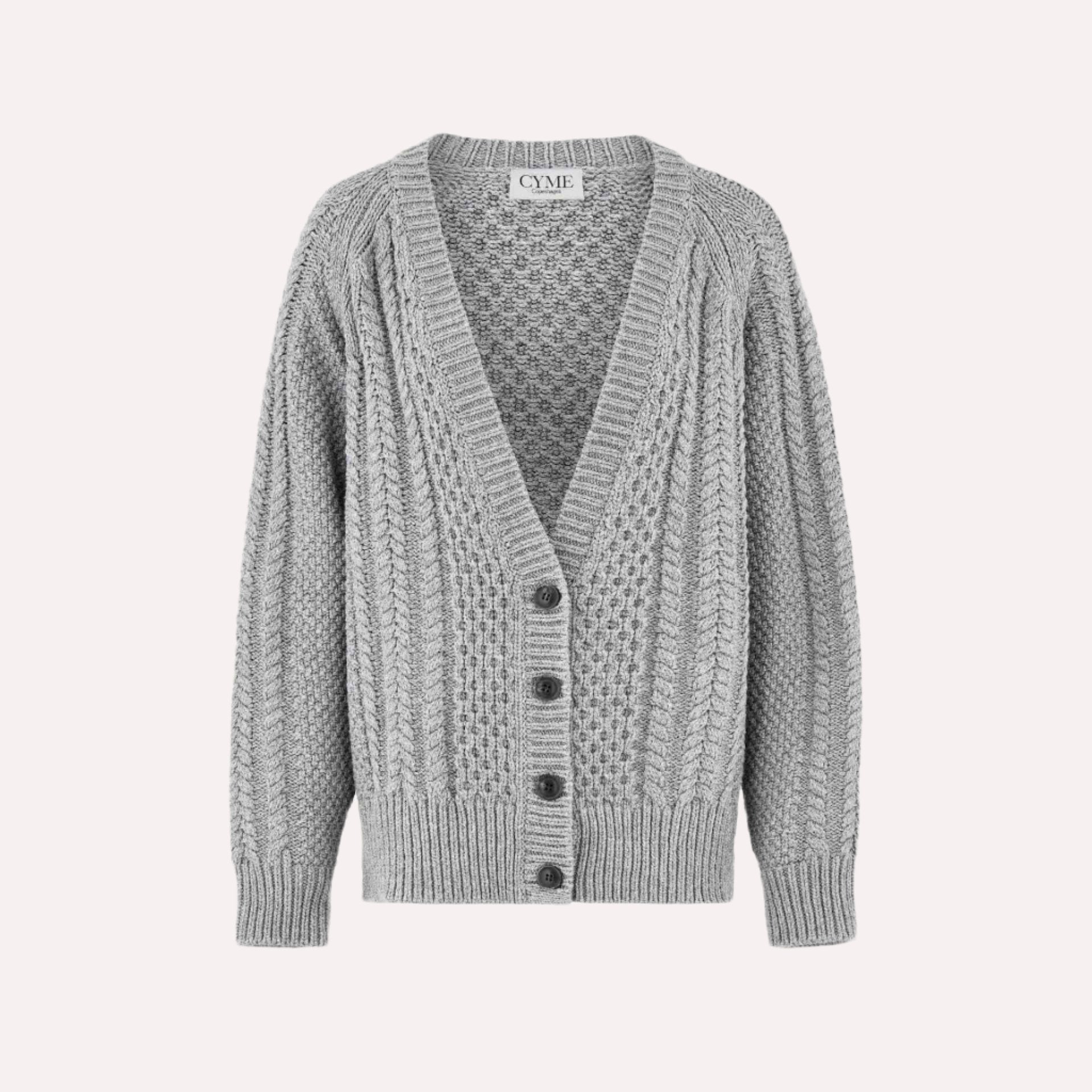 Front view of a light grey cable-knit cardigan with a deep V-neckline and button-up closure, featuring a textured knit pattern and ribbed cuffs and hem, displayed on a plain background.