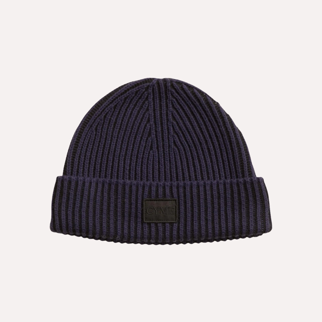 Classic navy cashmere beanie by Cyme Copenhagen, showcasing the brand's signature logo, perfect for a timeless look in the sustainable fashion collection of Scandinavia.