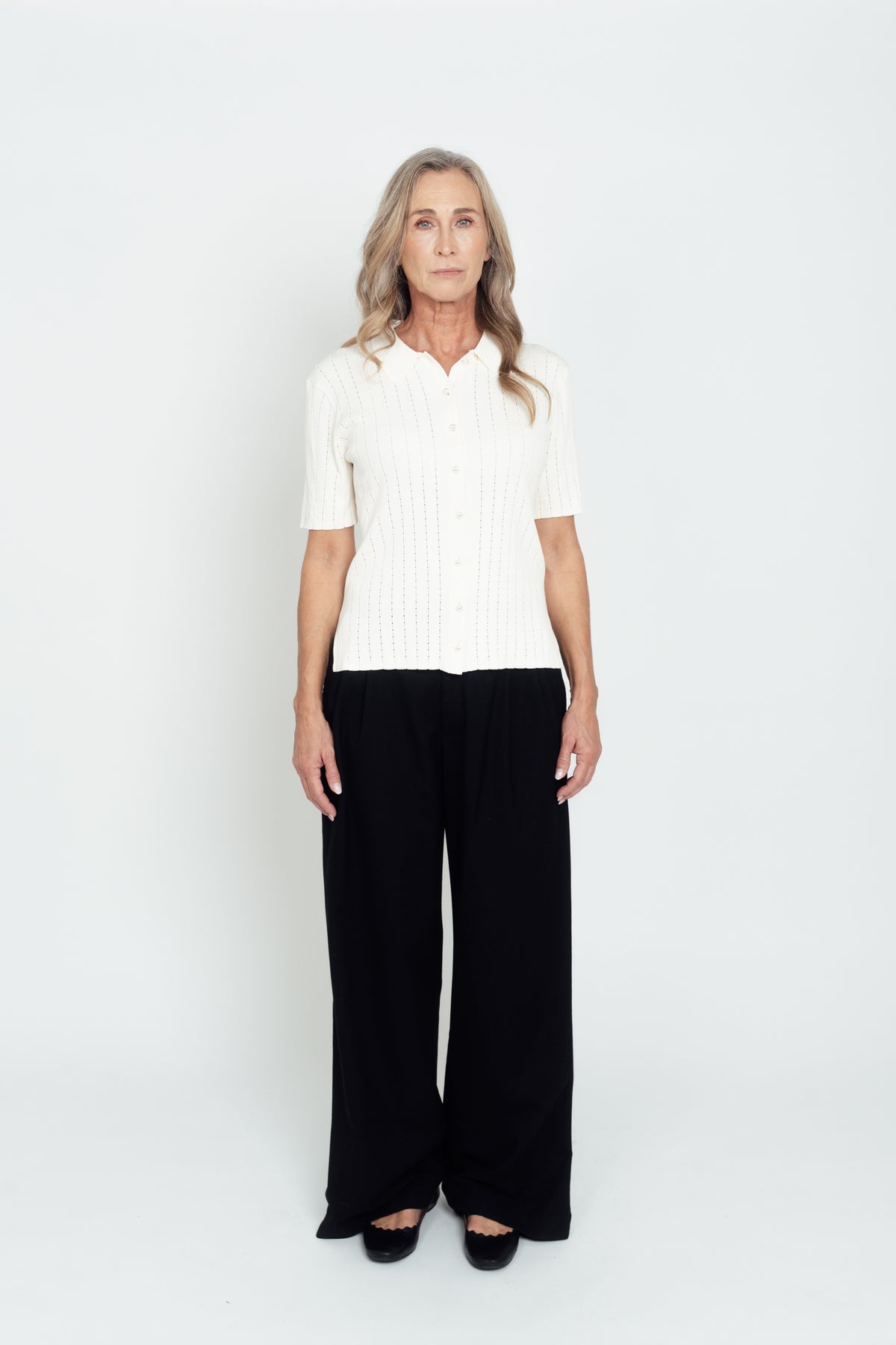 Front view of the ivory Pointelle Polo Shirt with short sleeves and a button front.